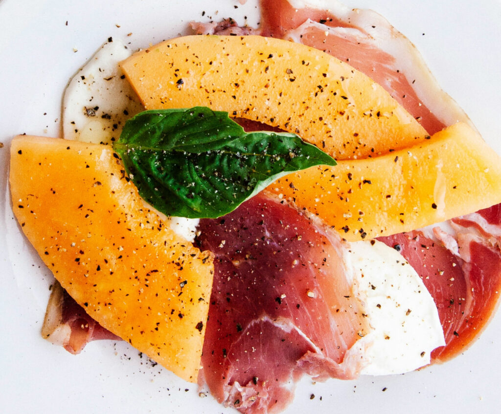 Close up of melon and prosciutto appetizer